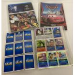 3 folders of assorted trading cards.