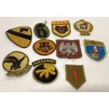 A collection of 10 Vietnam War style embroidered cloth patches.