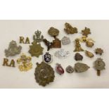 A quantity of assorted badges to include pin badges, cap badges and button hole badges.