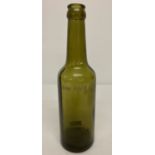 A WWII style German Waffen SS engraved green glass beer bottle.