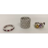 3 modern design silver stone set dress rings.