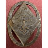 A WWII style German N.S.F.K bronze rally pin back badge.