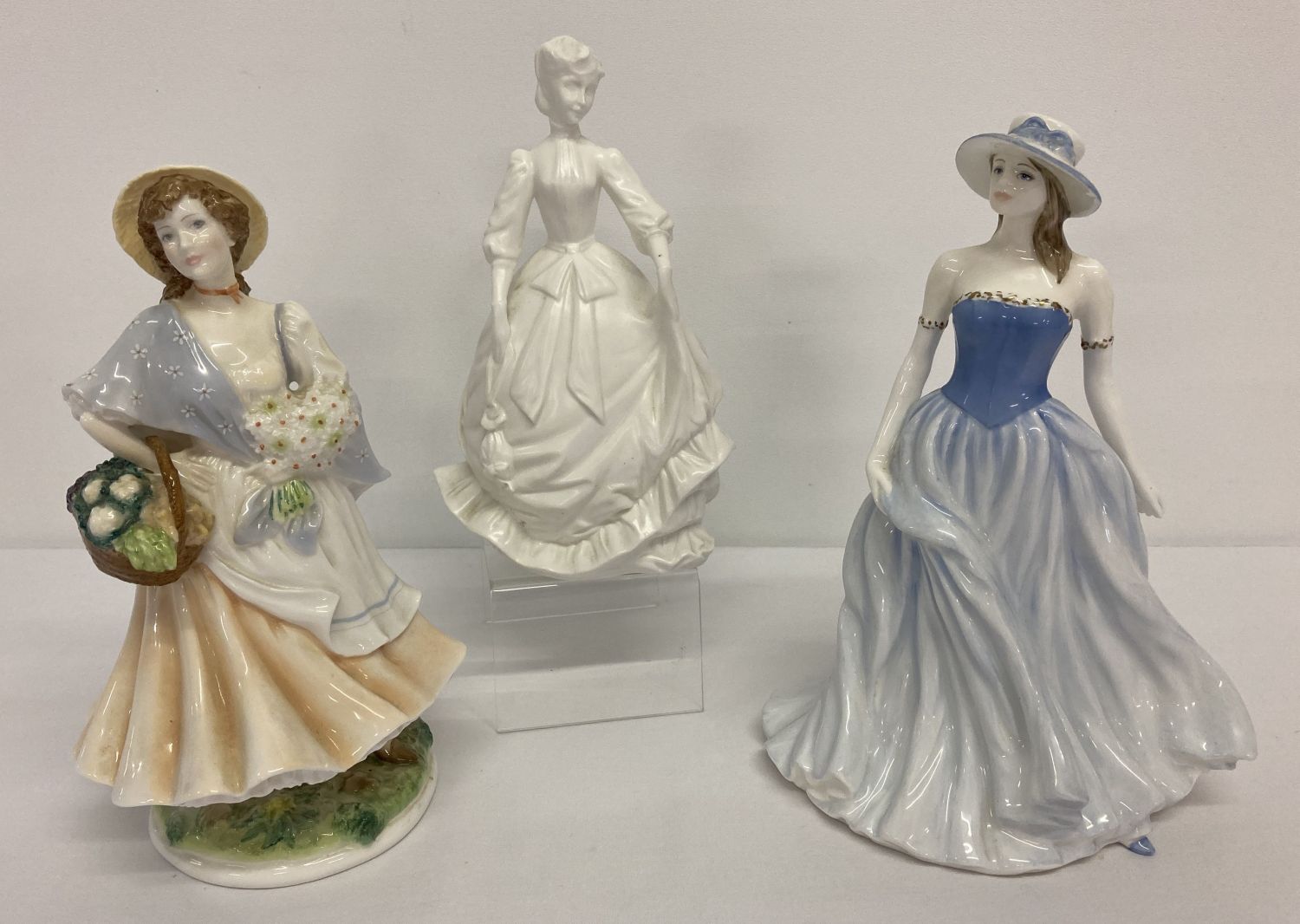 2 Royal Worcester ceramic figurines together with another by Royal Doulton.