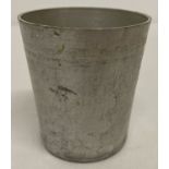 A German WWII style U-boat non metallic cup with engraved markings to base.