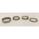 4 silver band style rings. To include a clear stone set full eternity ring.