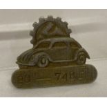 A German WWII style VW factory workers lapel ID badge.