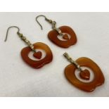 A pair of apple shaped carnelian drop earrings with matching pendant.