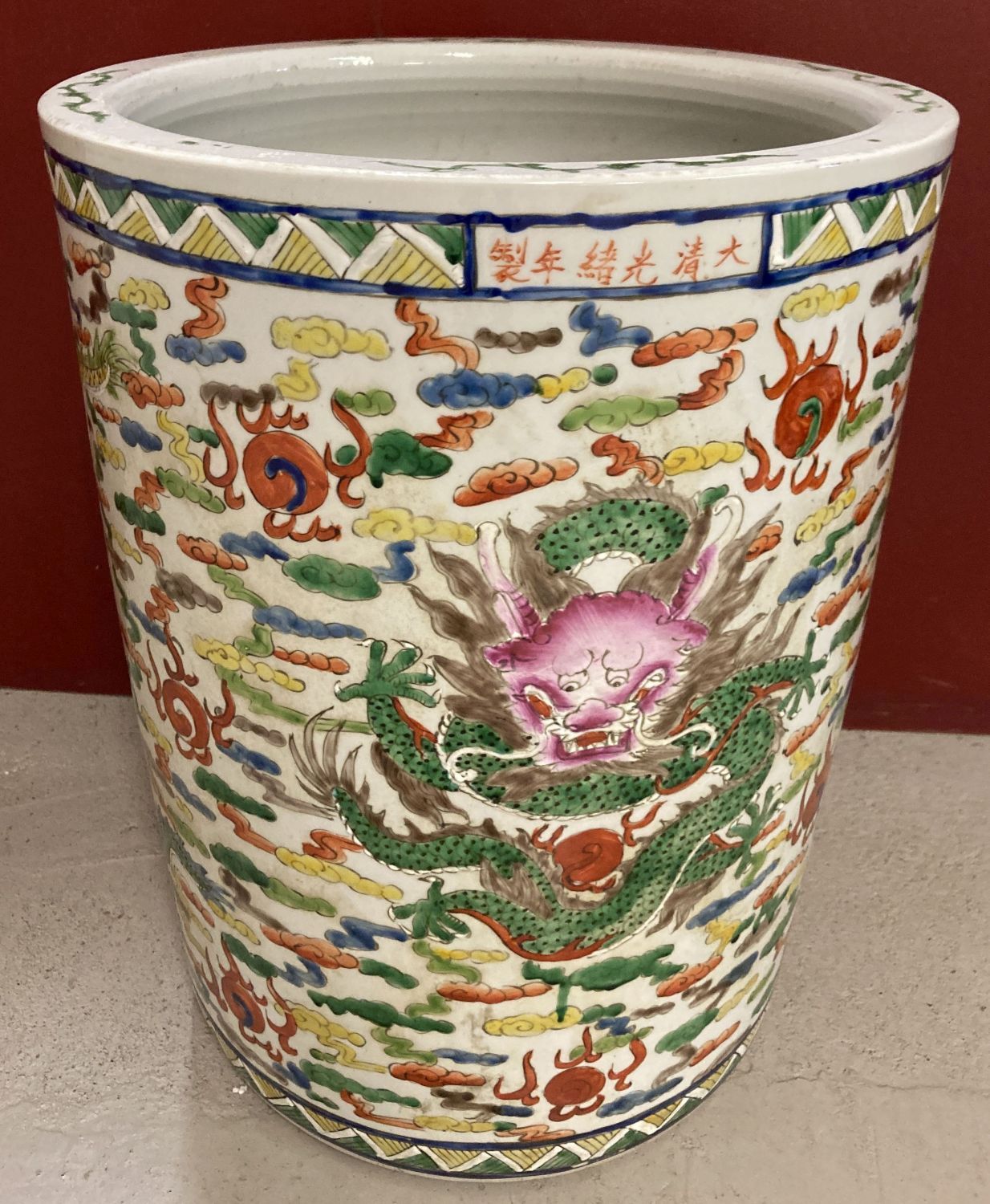 A large Chinese hand painted ceramic pot/planter, with dragon detail.