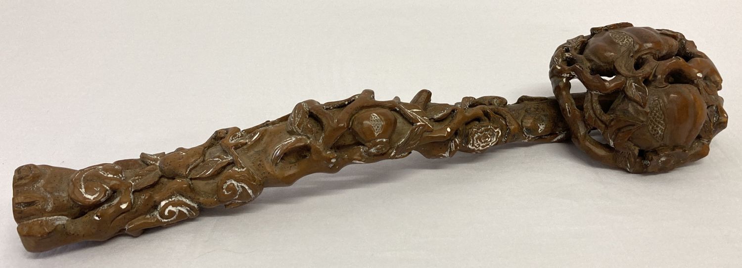 A highly carved wooden Chinese Ruyi sceptre with peach tree design.