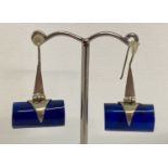 A pair of contemporary design silver drop style earrings, marked 925.