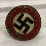 A WWII style German late war ersatz N.S.D.A.P button hole badge.