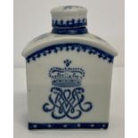 A blue and white ceramic oriental tea jar with monogram and crown design to front and back. .