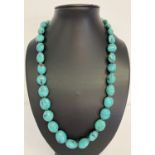 A chunky turquoise bead necklace with silver lobster style clasp, marked 925.