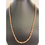 A vintage coral and pearl necklace with silver push clasp set with marcasite.