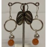 2 pairs of silver drop style earrings. A pair set with mother of pearl with marcasite set overlays.