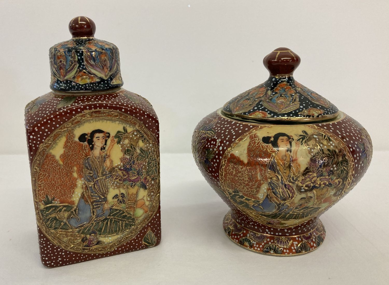 A satsuma style ceramic oriental tea jar with matching lidded sugar bowl.