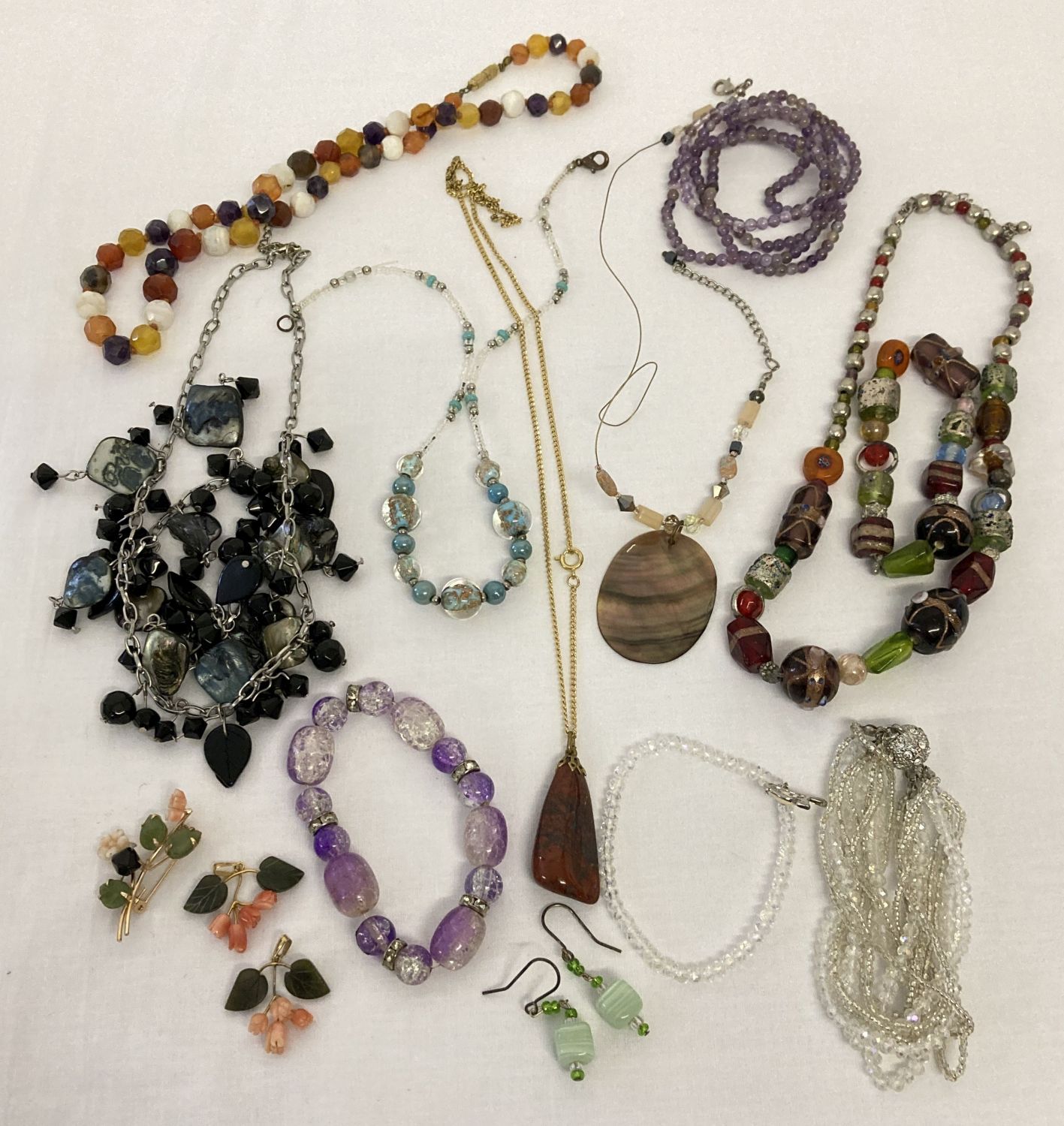 A small collection of glass bead and natural stone jewellery. To include a faceted agate bead