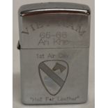 A windproof lighter with engraved detail in memoriam of 1st Air Cav, 1965-66.