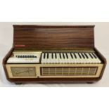 A vintage wooden case Piano Organ by Farfisa, Italy.