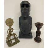 A small group of wooden, resin and metal ethnic figures.