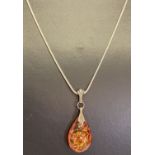 A silver and amber teardrop shaped pendant on a 20" silver snake chain.