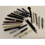 A collection of assorted vintage pens and propelling pencils.