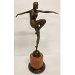 A large Art Deco style bronze figurine of a dancing woman mounted on circular marble plinth.