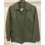 A ladies vintage golfer jacket in khaki green terylene by Grenfell.