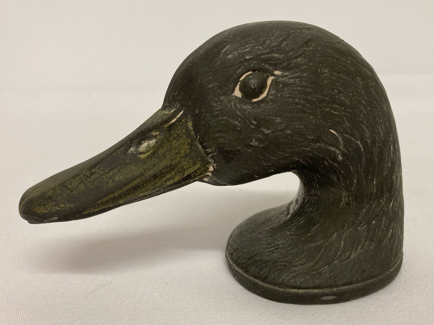 A vintage French metal "Duckey" bottle opener by Kirby Beard & Co. Paris.