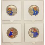 A set of 4 Paddington Bear 50p coins with coloured decals.