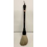 A very large vintage Chinese calligraphy brush with turned ebonised handle and real hair brush.