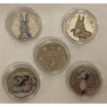 A set of 5 2016 Beatrix Potter commemorative 50p coins with coloured decals.