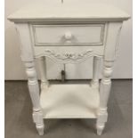 A small wooden occasional table with central drawer and undershelf.