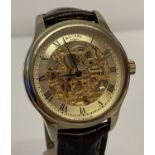 A men's skeleton style automatic watch by Rotary with brown leather crocodile effect strap.