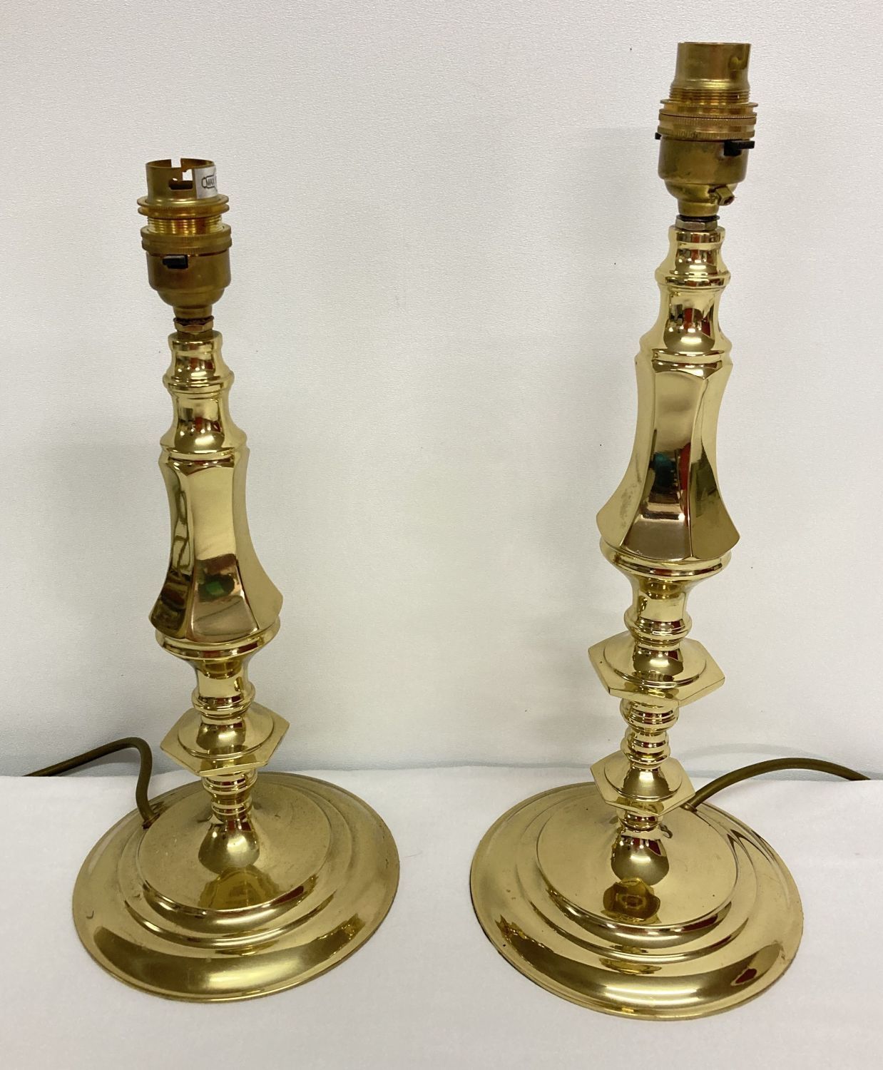 2 matching brass table lamps in a classical style.