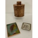 A vintage copper tea caddy with hammered effect decoration.