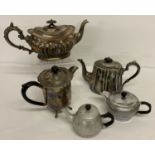 A collection of antique and vintage silver plate and metal ware teapots and water pot.