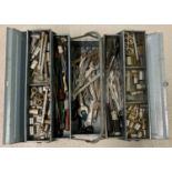A blue metal cantilever tool box containing a mostly sockets, spanners and screwdrivers.