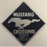 A square shaped painted cast iron wall hanging plaque for Mustang, powered by Ford.
