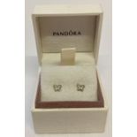 A pair of silver butterfly stud earrings set with small clear stones, by Pandora. In original box.
