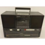 A portable Panasonic SC-J550C music system with record player, radio and cassette deck.