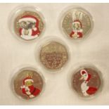 A set of 5 2016 Beatrix Potter commemorative 50p coins with coloured Christmas decals.