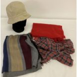 A Burberry bucket style hat with classic trim in size medium.