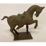 A heavy Chinese bronze figurine of a horse.