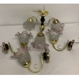 A wooden and brass effect 3 arm ceiling light with 3 matching wall lights. All with frosted and pink