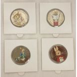 A set of 4 2018 Beatrix Potter 50p coins with coloured decals.