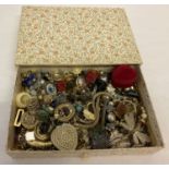 A box of vintage and modern costume jewellery, mostly rings and earrings.