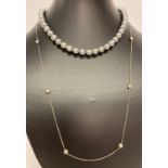 A vintage faux black pearl necklace with period stone set clasp.