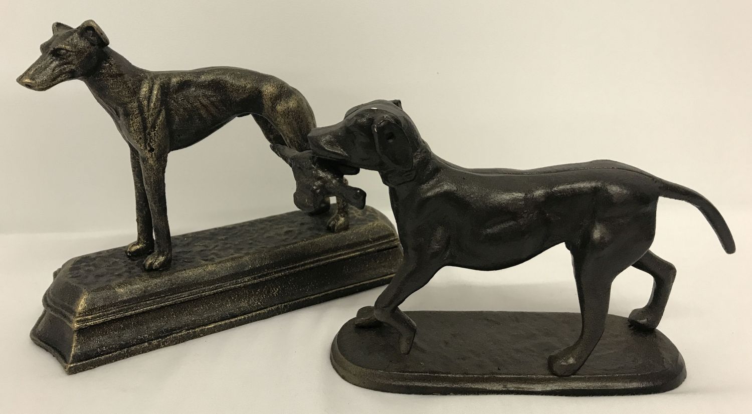 2 cast metal figures of dogs, a greyhound with bronzed effect finish, together with a retriever.