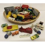 A quantity of assorted vintage play worn diecast vehicles,
